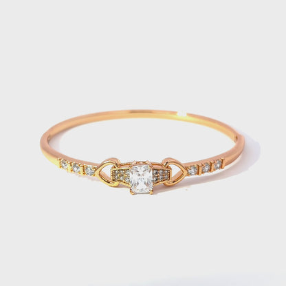 Elegant Gold Bangle with Emerald-Cut Diamond